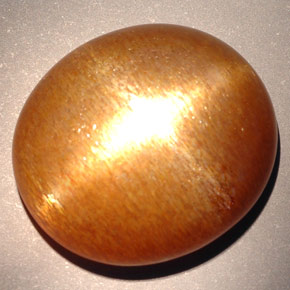 Pierre de soleil étoilée marron doré naturelle coupe ovale, 23,28 ct, opaque