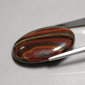 Tiger's eye matrix multicolore naturelle coupe ovale, 45,58 ct, opaque