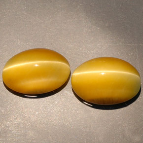 Achetez naturel ct jaune tiger's eye gems, coupe ovale, en provenance namibie chez gemselect. en stock, livraison internationale!