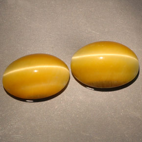Achetez naturel ct jaune tiger's eye gems, coupe ovale, en provenance namibie chez gemselect. en stock, livraison internationale!