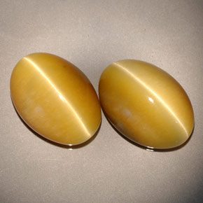 Achetez naturel ct jaune tiger's eye gems, coupe ovale, en provenance namibie chez gemselect. en stock, livraison internationale!