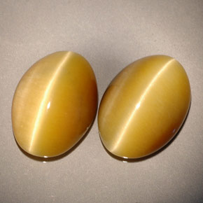 Achetez naturel ct jaune tiger's eye gems, coupe ovale, en provenance namibie chez gemselect. en stock, livraison internationale!