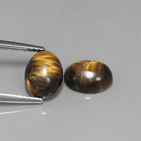 Achetez naturel ct marron tiger's eye gems, coupe ovale, en provenance thaïlande chez gemselect. en stock, livraison internationale!