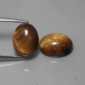 Achetez naturel ct marron tiger's eye gems, coupe ovale, en provenance thaïlande chez gemselect. en stock, livraison internationale!