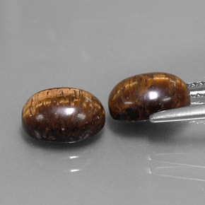 Achetez naturel ct marron tiger's eye gems, coupe ovale, en provenance thaïlande chez gemselect. en stock, livraison internationale!