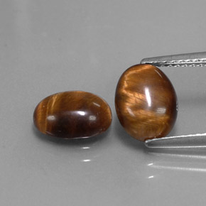 Achetez naturel ct marron tiger's eye gems, coupe ovale, en provenance thaïlande chez gemselect. en stock, livraison internationale!