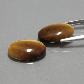 Achetez naturel ct marron tiger's eye gems, coupe ovale, en provenance thaïlande chez gemselect. en stock, livraison internationale!