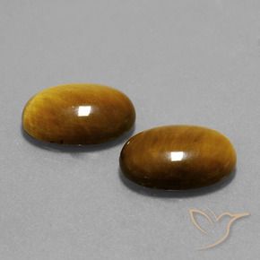Shop natural 9.06ct Brun doré Œil de tigre gems, ovale, from Thaïlande at GemSelect. In stock, global shipping!