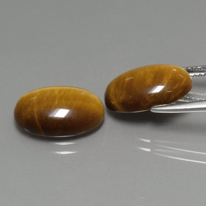 Achetez naturel ct marron tiger's eye gems, coupe ovale, en provenance thaïlande chez gemselect. en stock, livraison internationale!