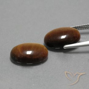 Shop natural 9.06ct Brun doré Œil de tigre gems, ovale, from Thaïlande at GemSelect. In stock, global shipping!