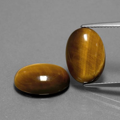 Achetez naturel 8.94ct Brun doré Oeil de Tigre gems, Coupe ovale, En provenance Thaïlande chez GemSelect. En stock, livraison internationale!