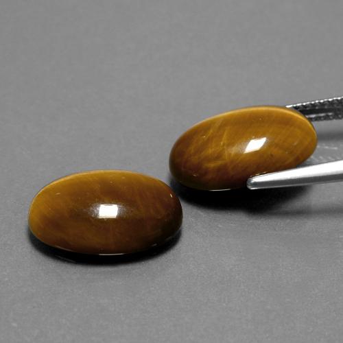 Achetez naturel 8.94ct Brun doré Oeil de Tigre gems, Coupe ovale, En provenance Thaïlande chez GemSelect. En stock, livraison internationale!