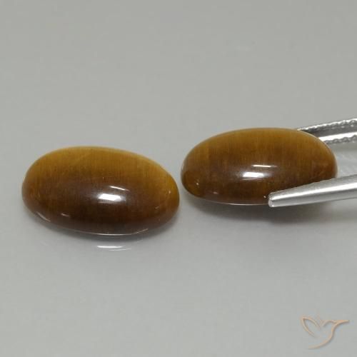 Shop natural 9.16ct Marron chaud Œil de tigre gems, ovale, from Thaïlande at GemSelect. In stock, global shipping!