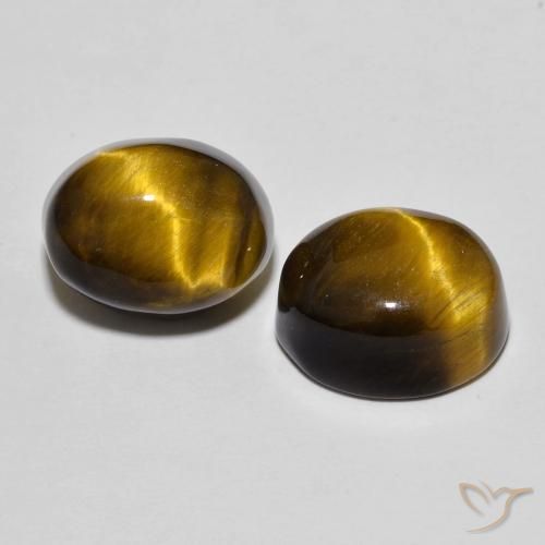 Shop natural 10.69ct Brun doré Œil de tigre gems, ovale, from Thaïlande at GemSelect. In stock, global shipping!