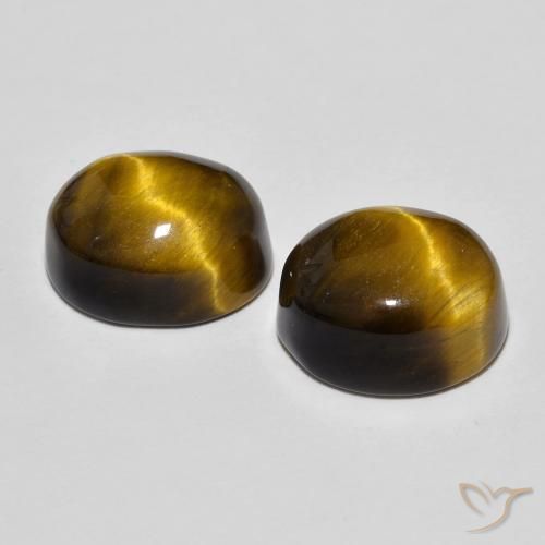 Shop natural 10.69ct Brun doré Œil de tigre gems, ovale, from Thaïlande at GemSelect. In stock, global shipping!