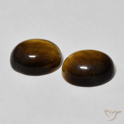 Shop natural 6.34ct Brun doré Œil de tigre gems, ovale, from Thaïlande at GemSelect. In stock, global shipping!
