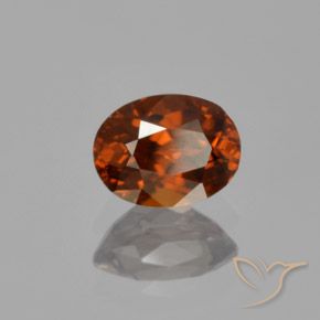 Zircon Orange rougeâtre naturelle ovale, 1.22 ct, VVS