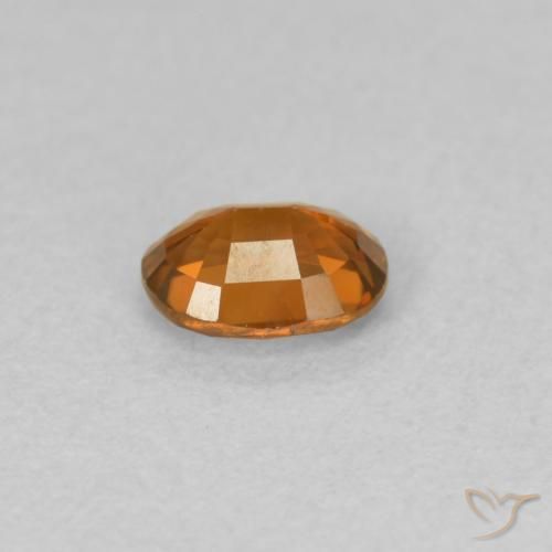 Zircon Orange foncé naturelle ovale, 0.59 ct, VVS-VS