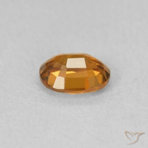 Zircon Orange foncé naturelle ovale, 0.60 ct, VVS-VS