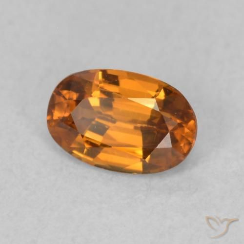Zircon Orange brunâtre naturelle ovale, 0.73 ct, VVS-VS