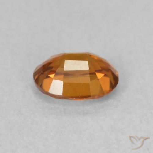 Zircon Orange foncé naturelle ovale, 0.60 ct, VVS-VS