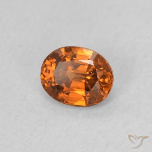 Zircon Orange foncé naturelle ovale, 0.60 ct, VS