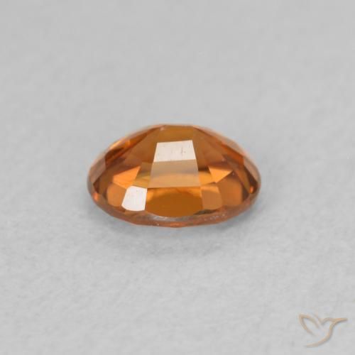 Zircon Orange foncé naturelle ovale, 0.60 ct, VS