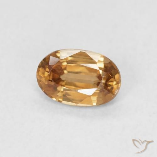 Zircon Orange brunâtre naturelle ovale, 0.74 ct, VVS-VS