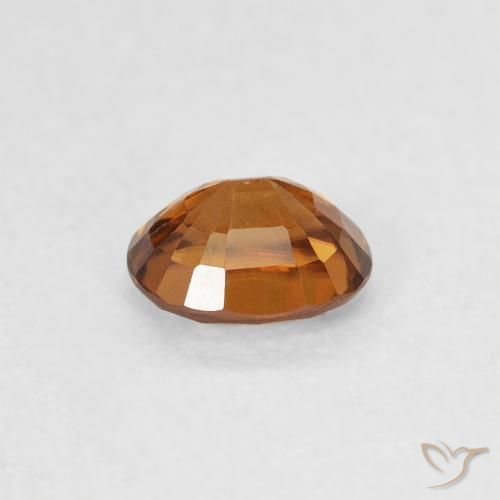 Zircon Orange foncé naturelle ovale, 0.61 ct, VS
