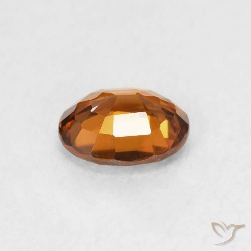 Zircon Orange foncé naturelle ovale, 0.83 ct, VVS