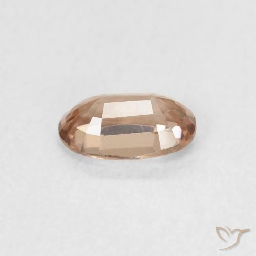 Zircon Rose orangé léger naturelle ovale, 0.72 ct, VVS