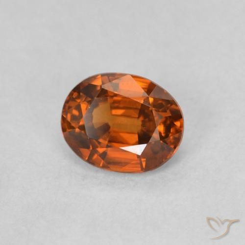 Zircon Orange rougeâtre naturelle ovale, 0.62 ct, VVS