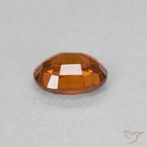 Zircon Orange rougeâtre naturelle ovale, 0.62 ct, VVS