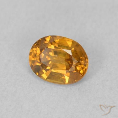 Zircon Orange rouille naturelle ovale, 0.60 ct, VVS