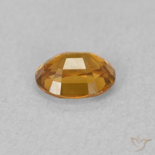 Zircon Orange rouille naturelle ovale, 0.60 ct, VVS
