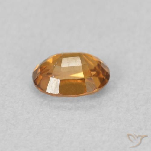 Zircon Orange brun naturelle ovale, 0.64 ct, VVS