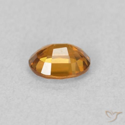 Zircon Orange brun naturelle ovale, 0.57 ct, VVS