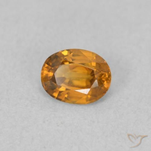 Zircon Orange brunâtre naturelle ovale, 0.59 ct, VVS-VS