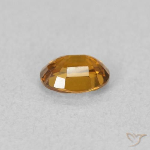 Zircon Orange brunâtre naturelle ovale, 0.59 ct, VVS-VS
