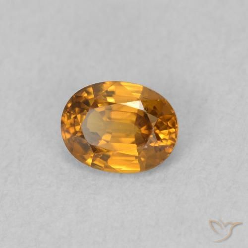 Zircon Orange brunâtre naturelle ovale, 0.63 ct, VVS-VS