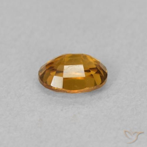 Zircon Orange brunâtre naturelle ovale, 0.63 ct, VVS-VS