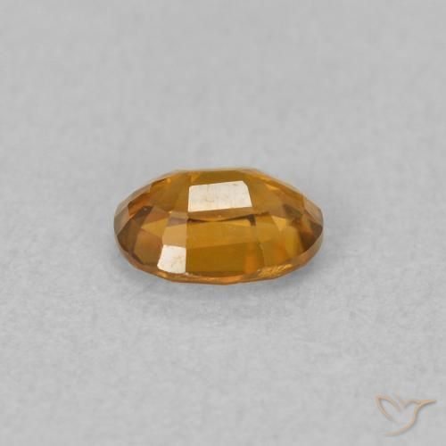Zircon Orange brunâtre naturelle ovale, 0.58 ct, VVS-VS