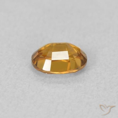 Zircon Orange rouille naturelle ovale, 0.65 ct, VVS