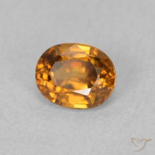 Zircon Orange brun naturelle ovale, 0.64 ct, VVS