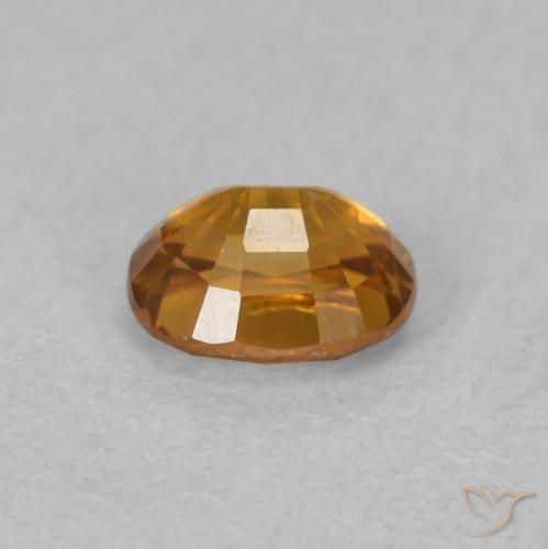 Zircon Orange brun naturelle ovale, 0.64 ct, VVS