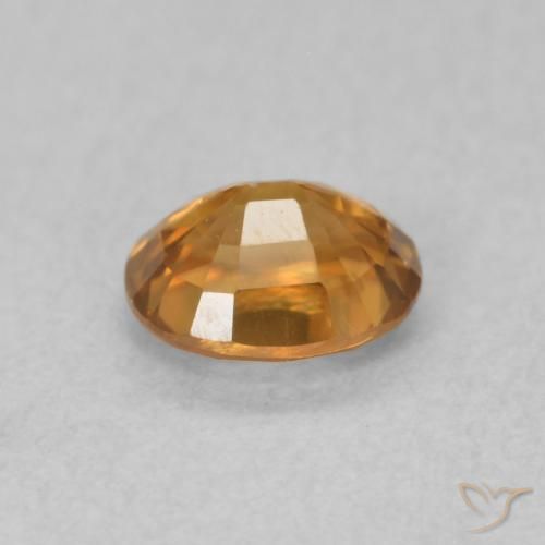 Zircon Orange brun naturelle ovale, 0.67 ct, VS