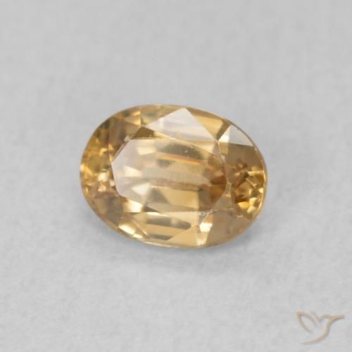 Zircon Pêche doré naturelle ovale, 0.57 ct, VS