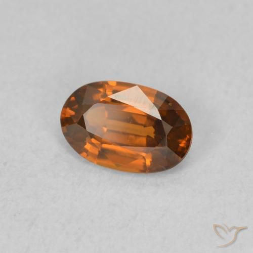 Zircon Orange rougeâtre naturelle ovale, 0.64 ct, VVS