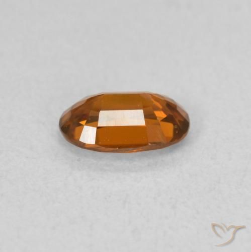 Zircon Orange rougeâtre naturelle ovale, 0.64 ct, VVS