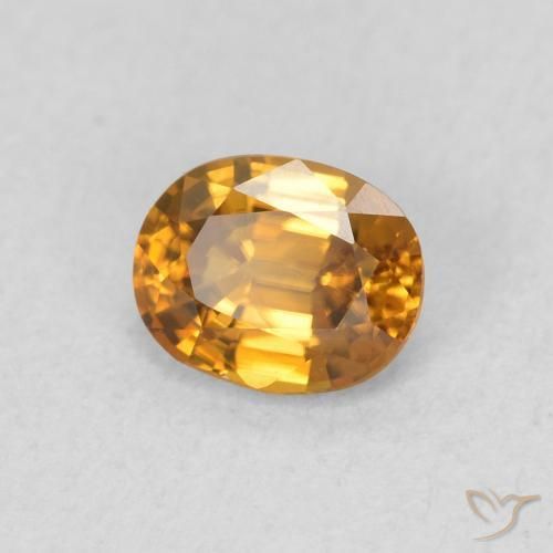 Zircon Orange brunâtre naturelle ovale, 0.65 ct, VVS-VS